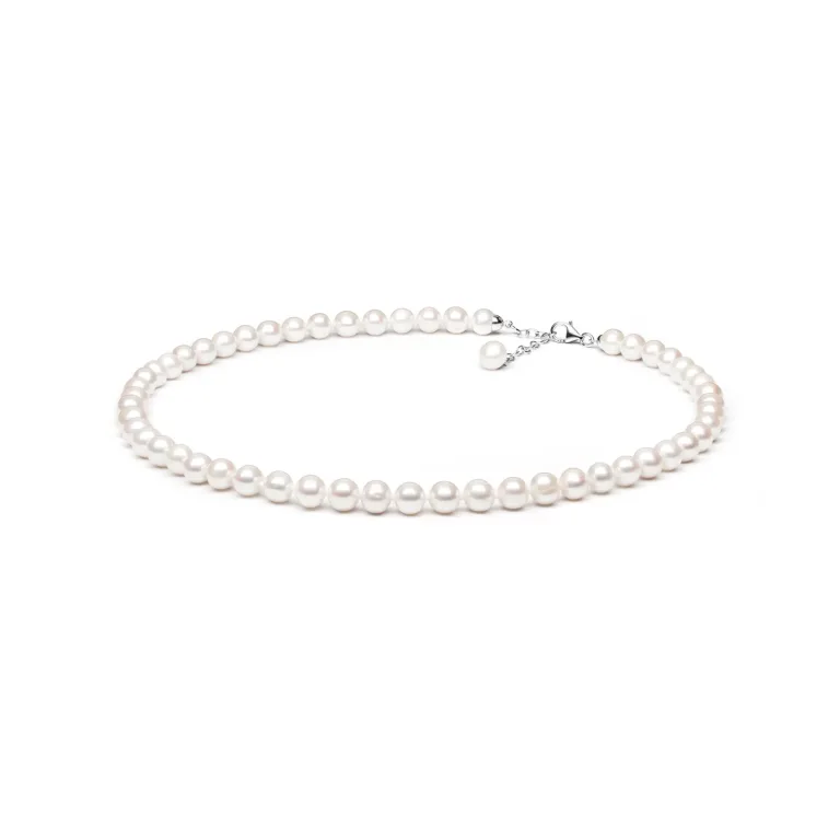 A classic pearl necklace featuring lustrous white pearls and a silver clasp, elegantly displayed on a white background.